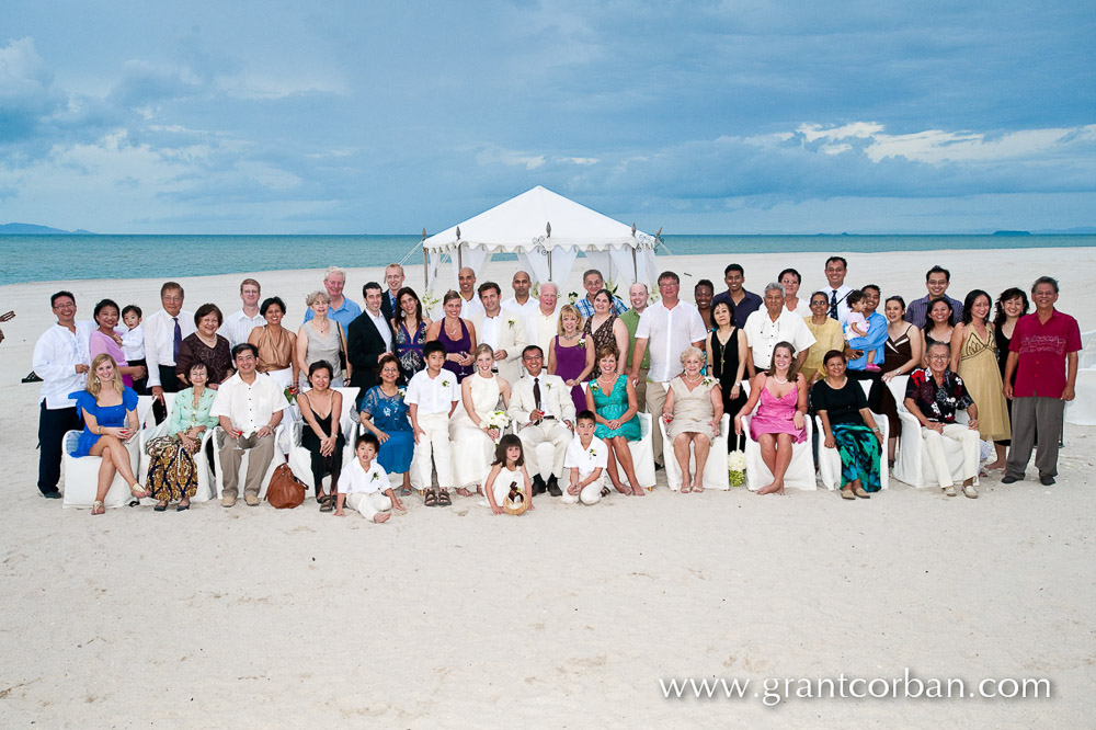 Group photo at a Beach wedding at the Four Seasons Hotel Resort on Langkawi Malaysia