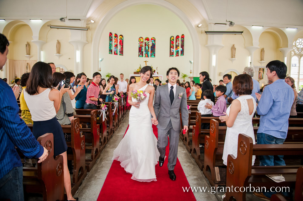 Wedding couple recessional march in St Johns Cathedral Kuala Lumpur