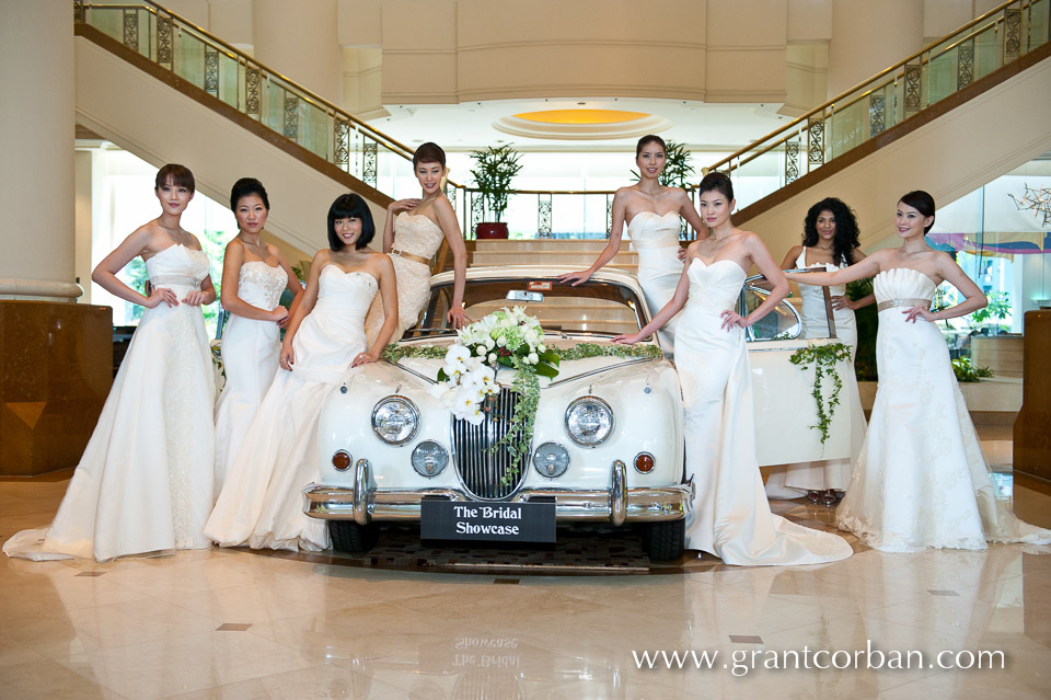 Beautiful Wedding Car surrounded by pretty models