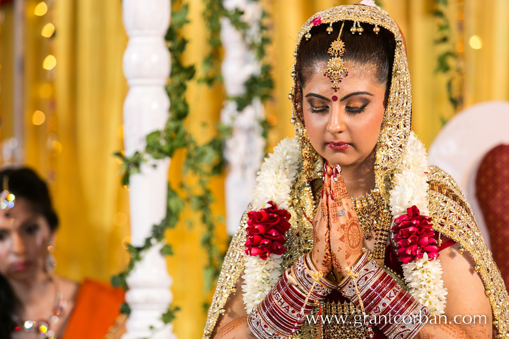 Bride performing hindu wedding ritual