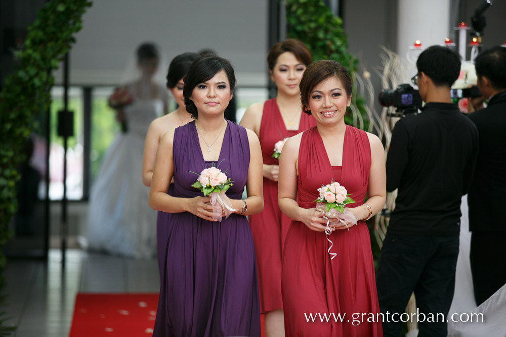 The bridesmaids leading the bride to the altar